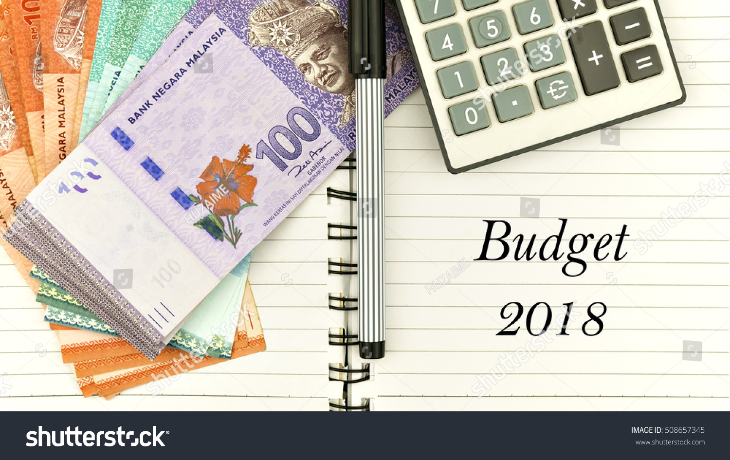 conceptual image with cash, calculator and notepad with word " budget 2018" #508657345