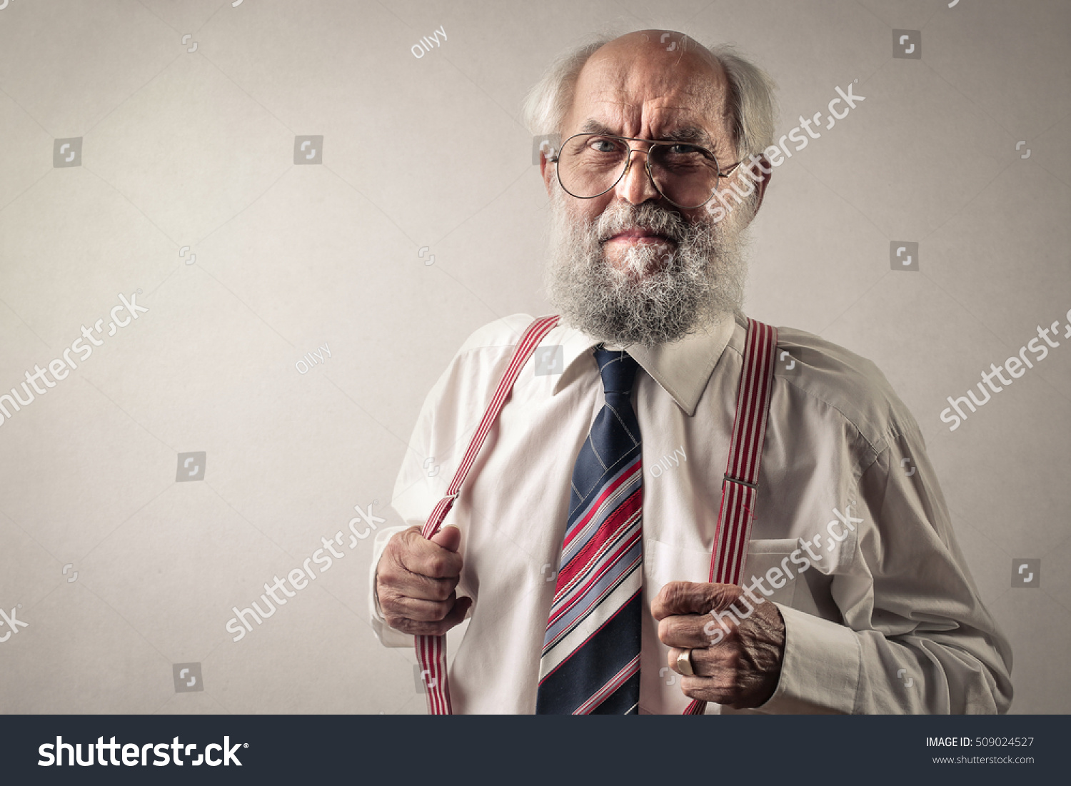 Old man wearing suspenders #509024527