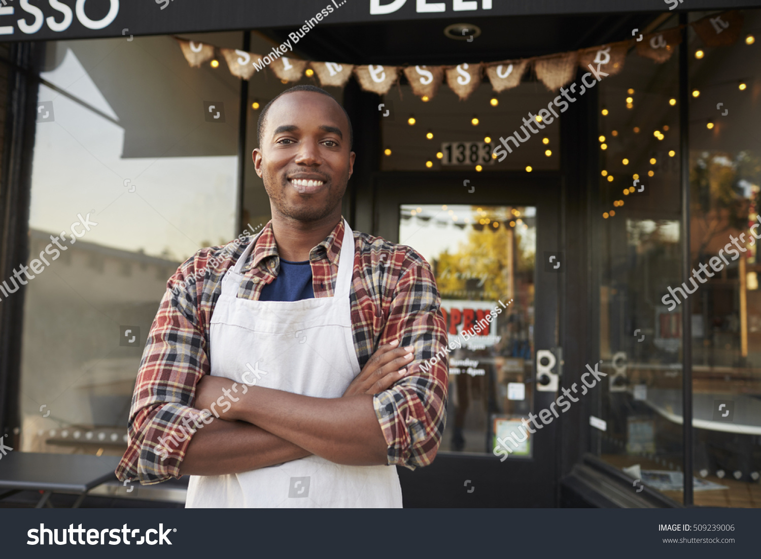 Black male business owner standing outside coffee shop #509239006