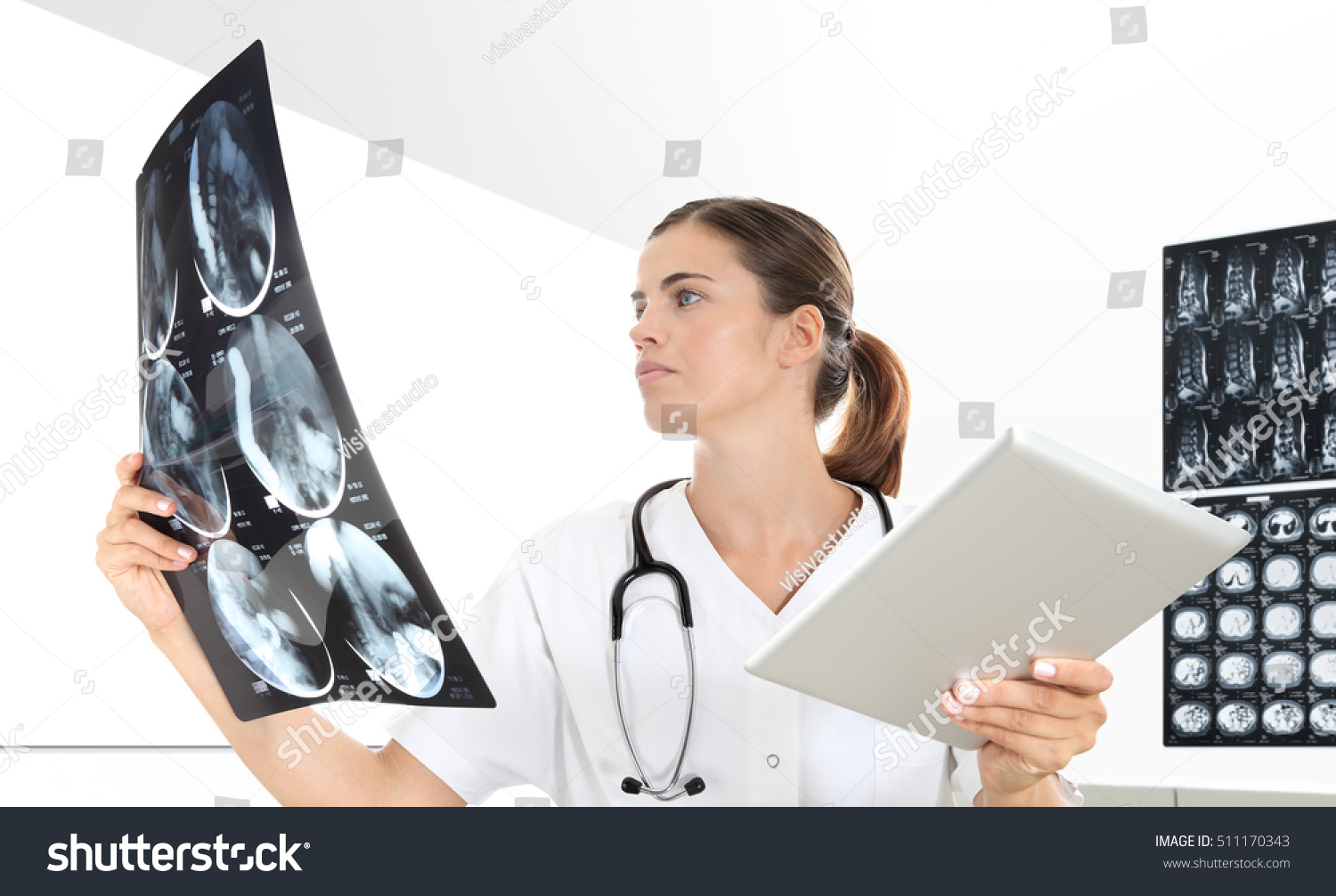Radiologist woman checking x-ray, health care, medical and radiology concept #511170343