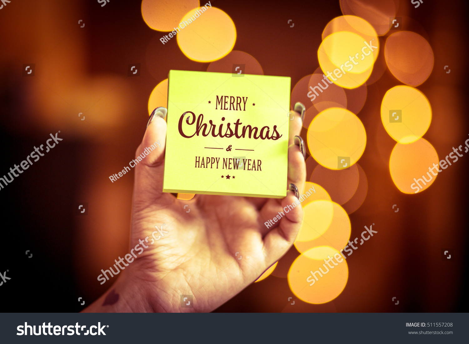 Merry Christmas and Happy New Year on bokeh background, festive defocused lights.
 #511557208