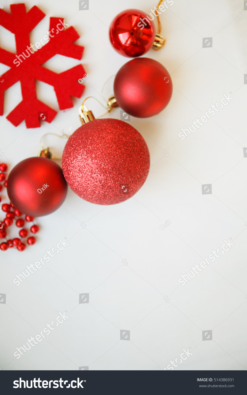 red christmas balls, decorations, red beards and red snowflake on white background, top view, selective focus #514386931