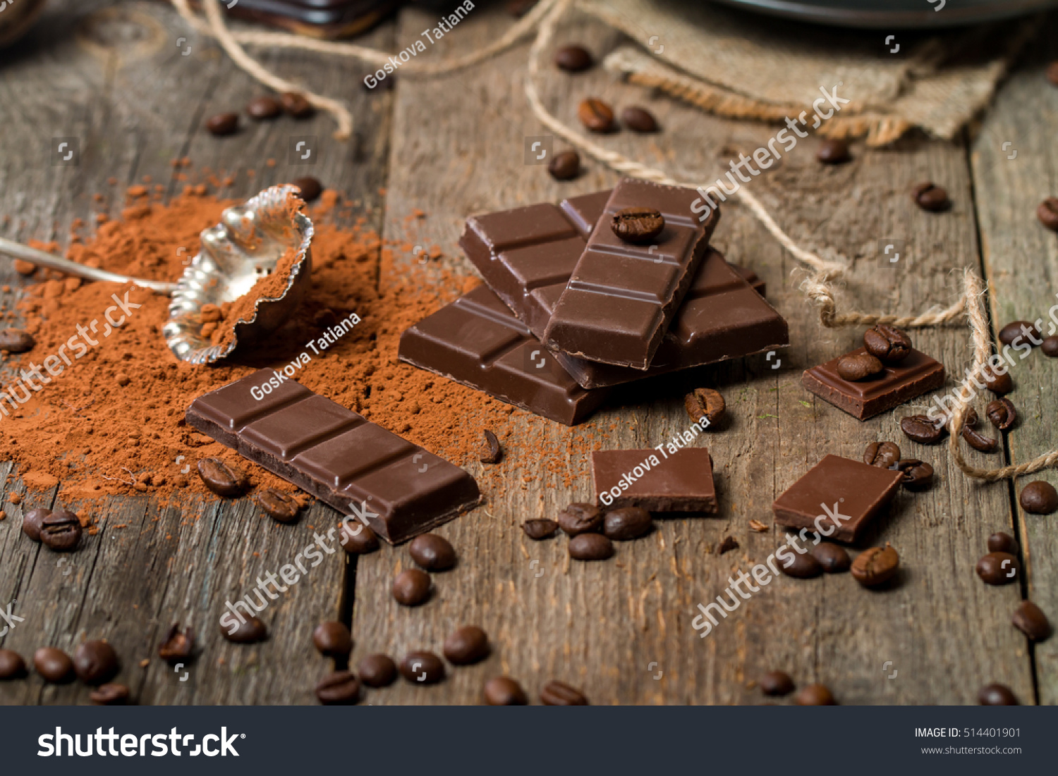 Cocoa Powder and Dark Chocolate on old wooden table #514401901