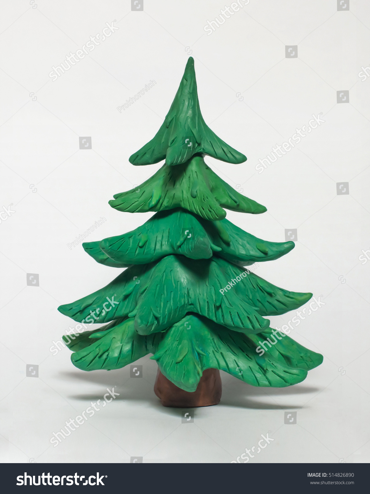 
Beautiful green Christmas tree without ornaments. The tree of plasticine on a white background #514826890