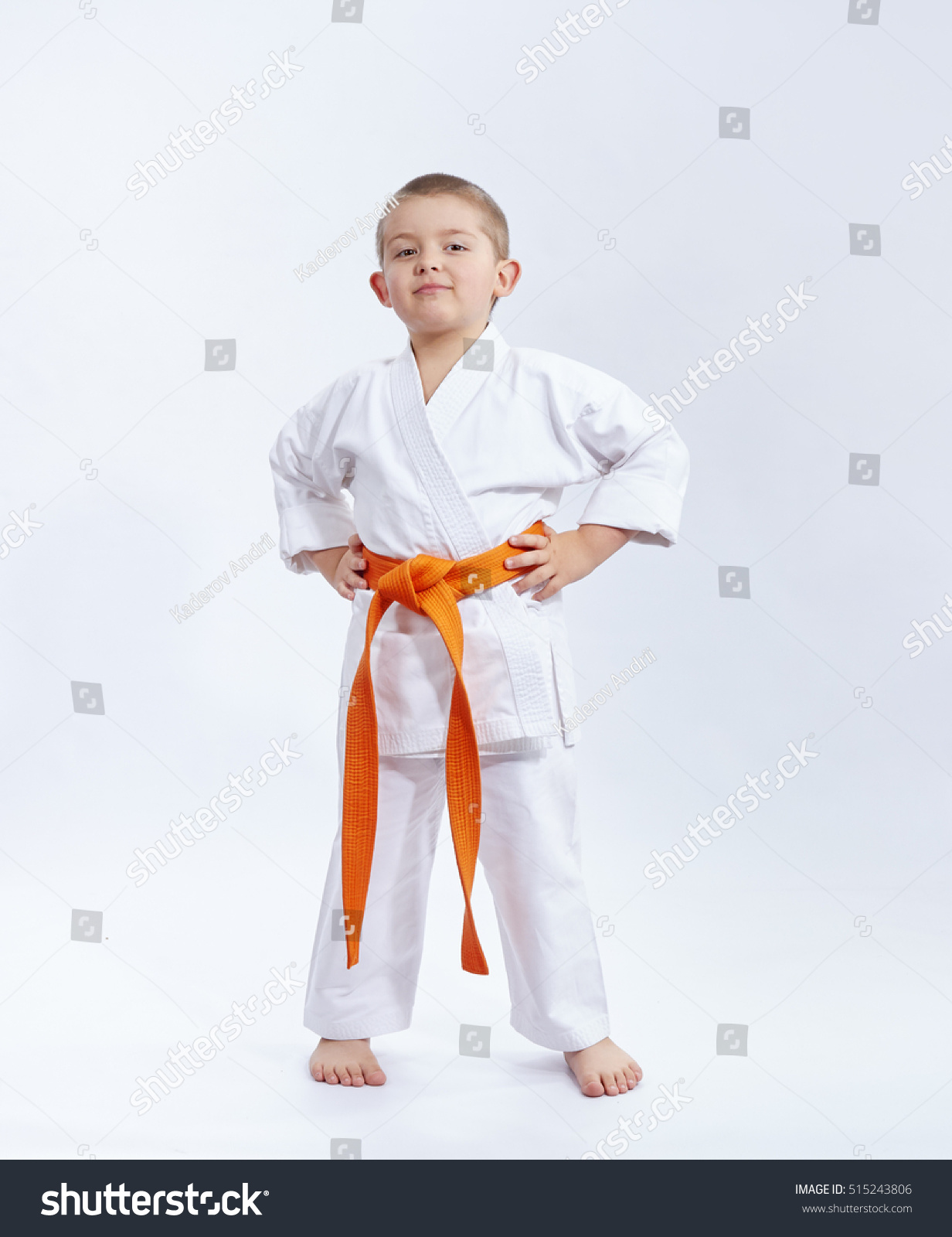 With orange belt athlete on a white background #515243806