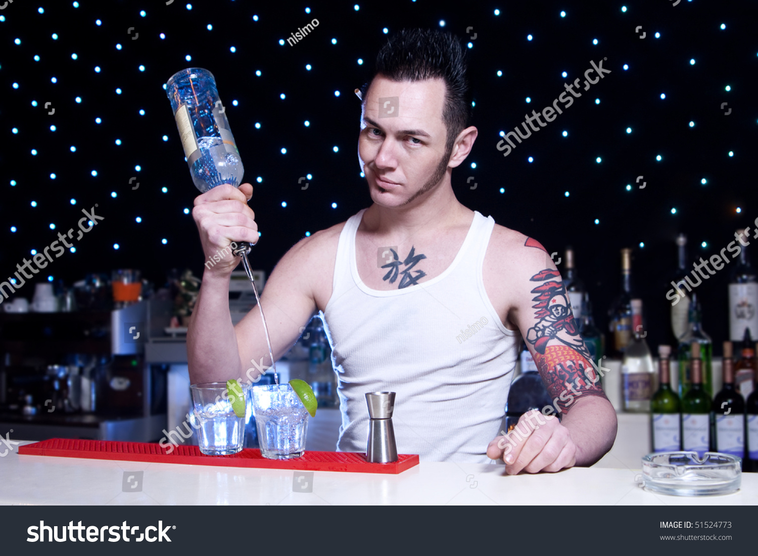bartender is smiling and looking at the camera #51524773