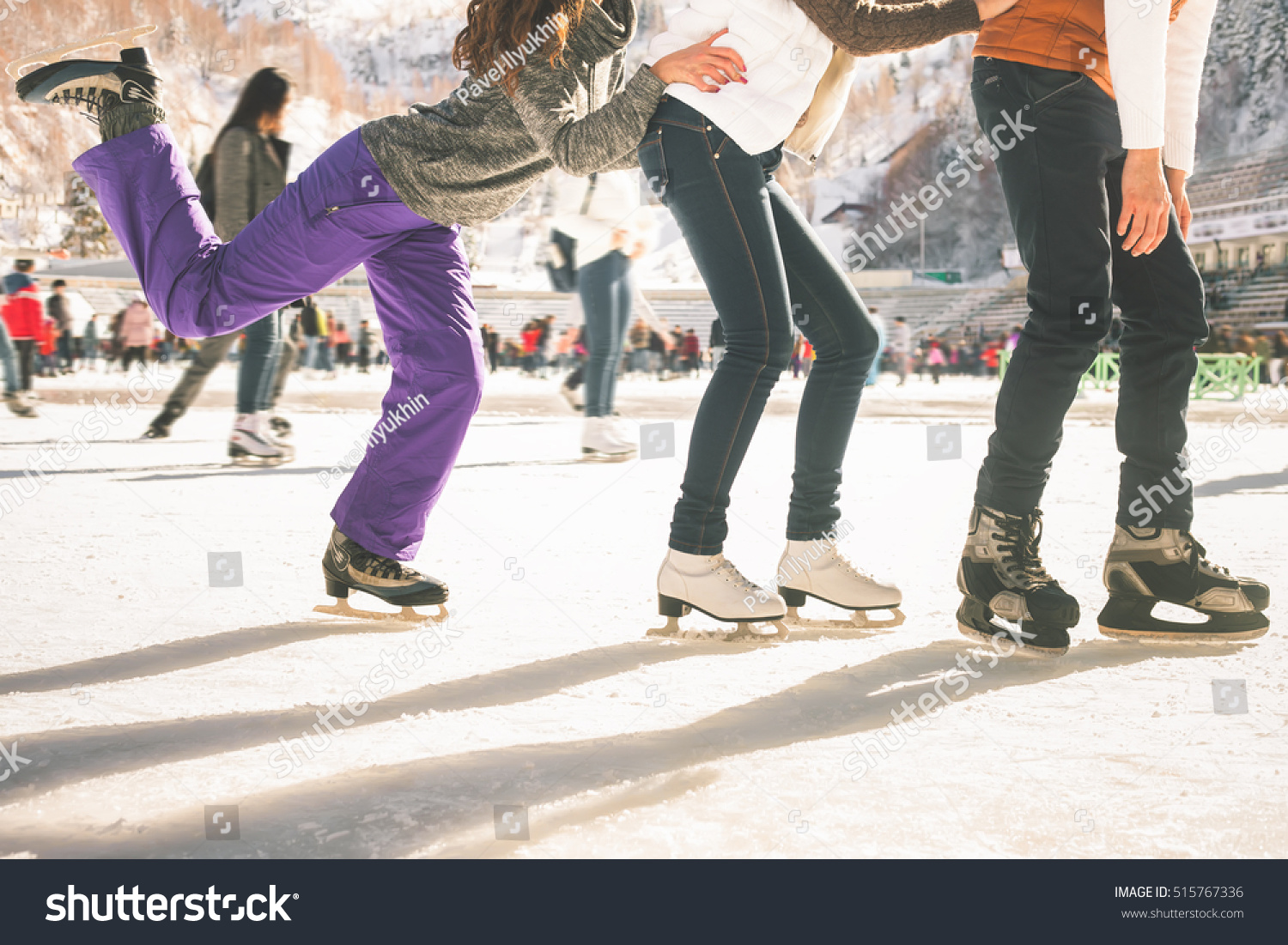 Funny teenagers girls and boy skating outdoor, ice rink #515767336