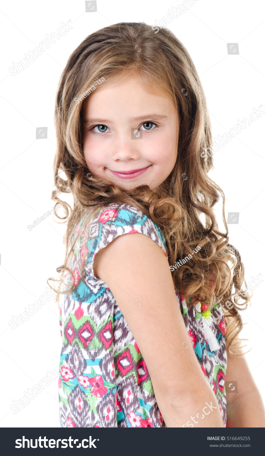 Portrait of adorable smiling  little girl isolated on a white #516649255