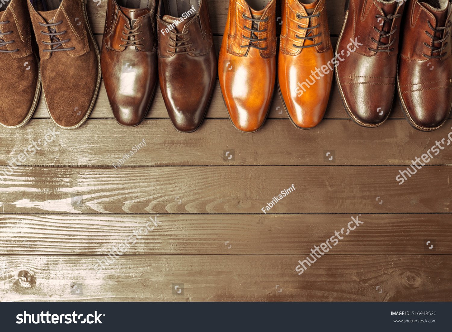 Fashion concept with male shoes on wooden background #516948520
