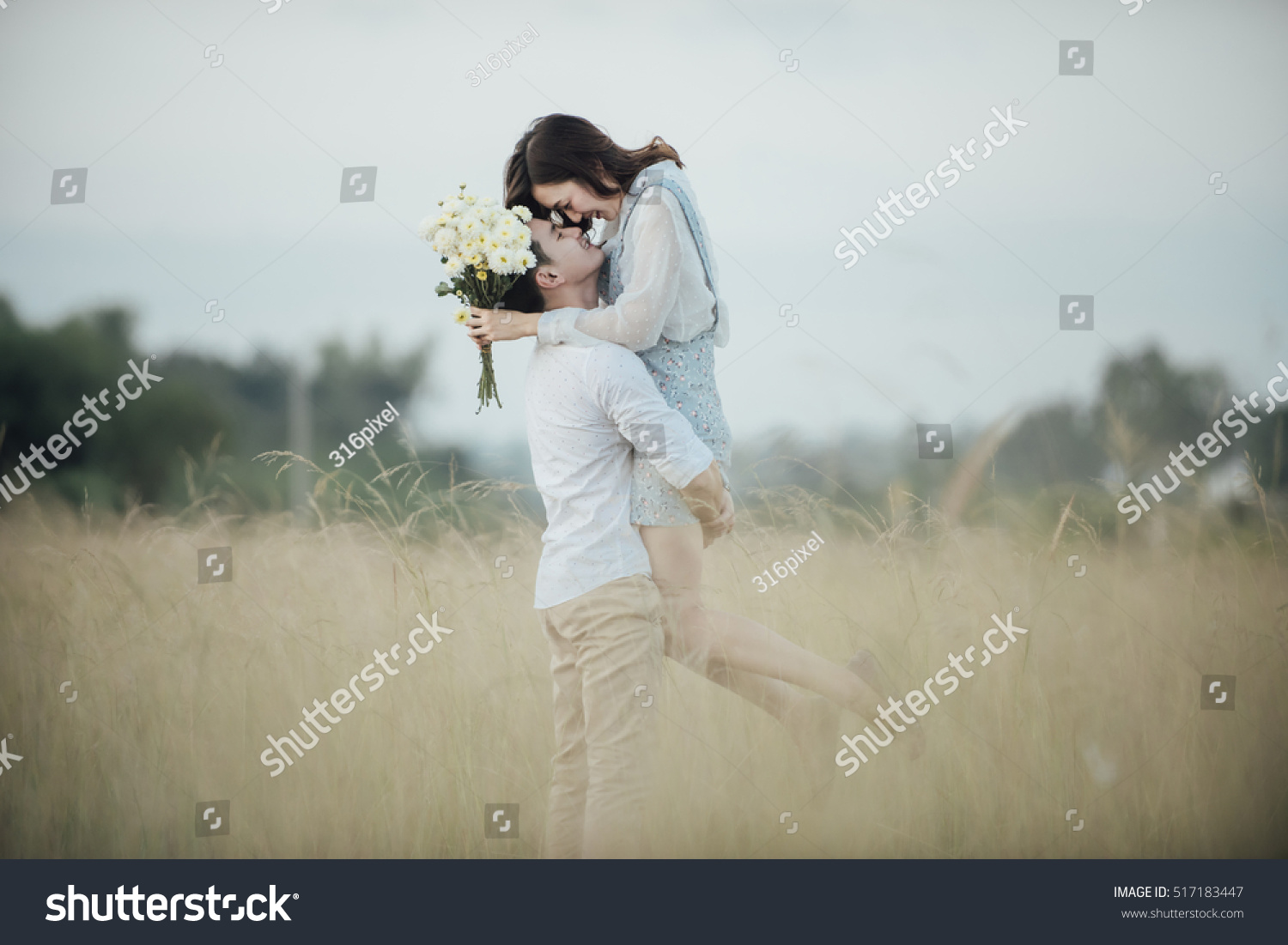 happy young couple in romance on summer beautiful landscape #517183447