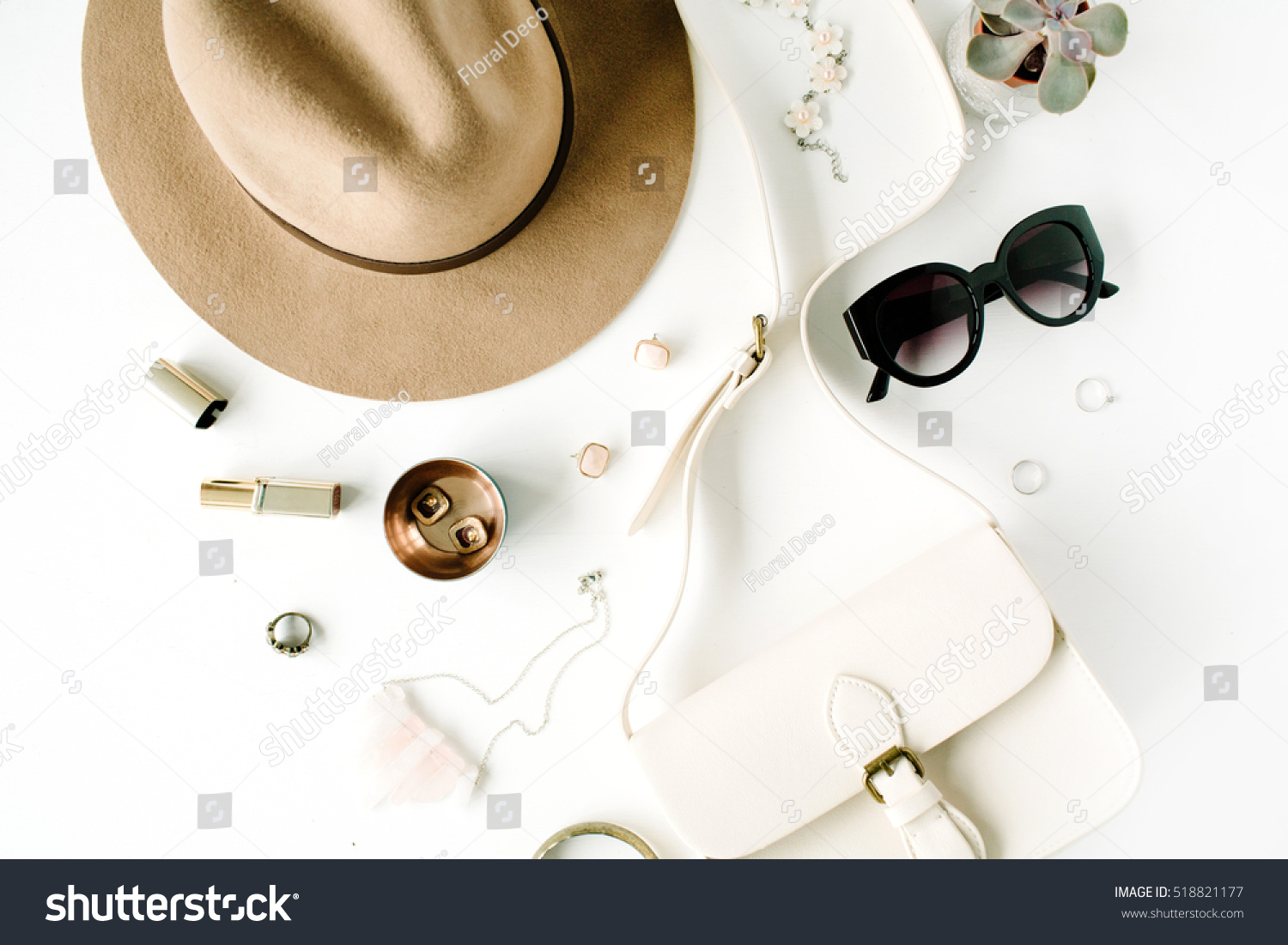Flat lay trendy creative feminine accessories arrangement. Purse, hat, sunglasses, female accessories. Top view #518821177