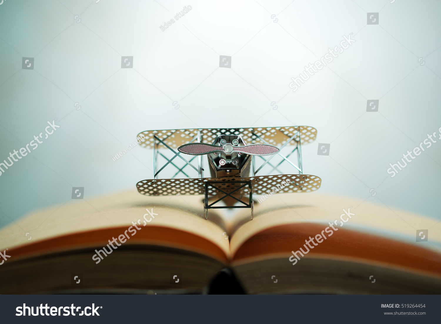 aircraft fighter on open education book with abstract light , education planner
concept. #519264454
