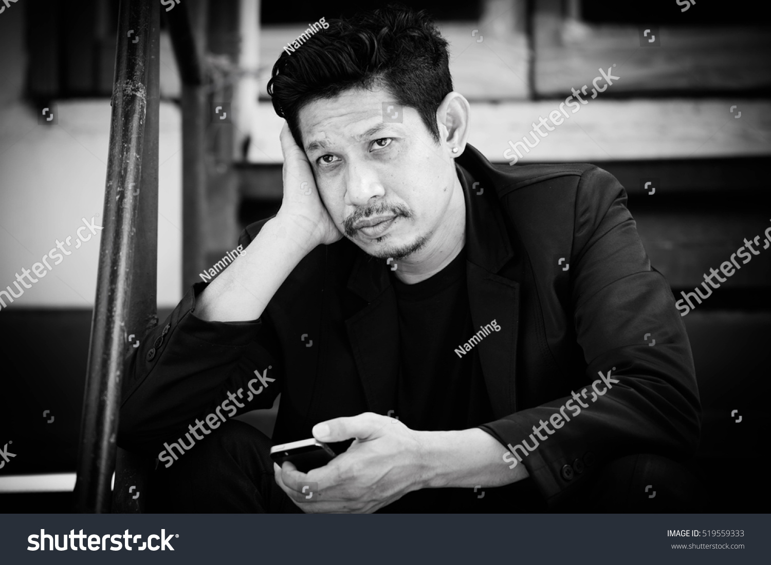 Businessman with smart phone,frustrated,Black and white #519559333