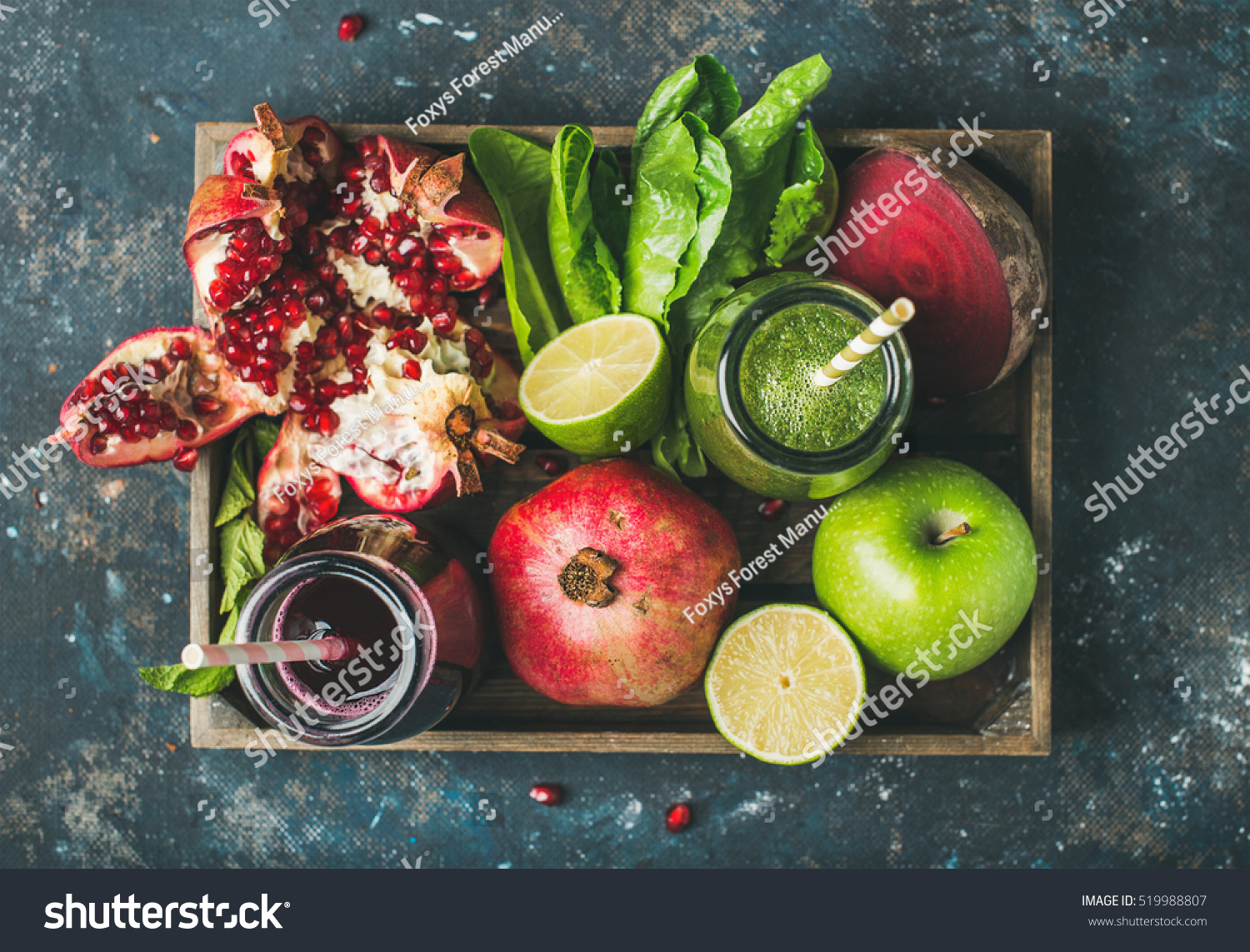 Green and purple fresh juices or smoothies with fruit, greens, vegetables in wooden tray, top view, selective focus. Detox, dieting, clean eating, vegetarian, vegan, fitness, healthy lifestyle concept #519988807