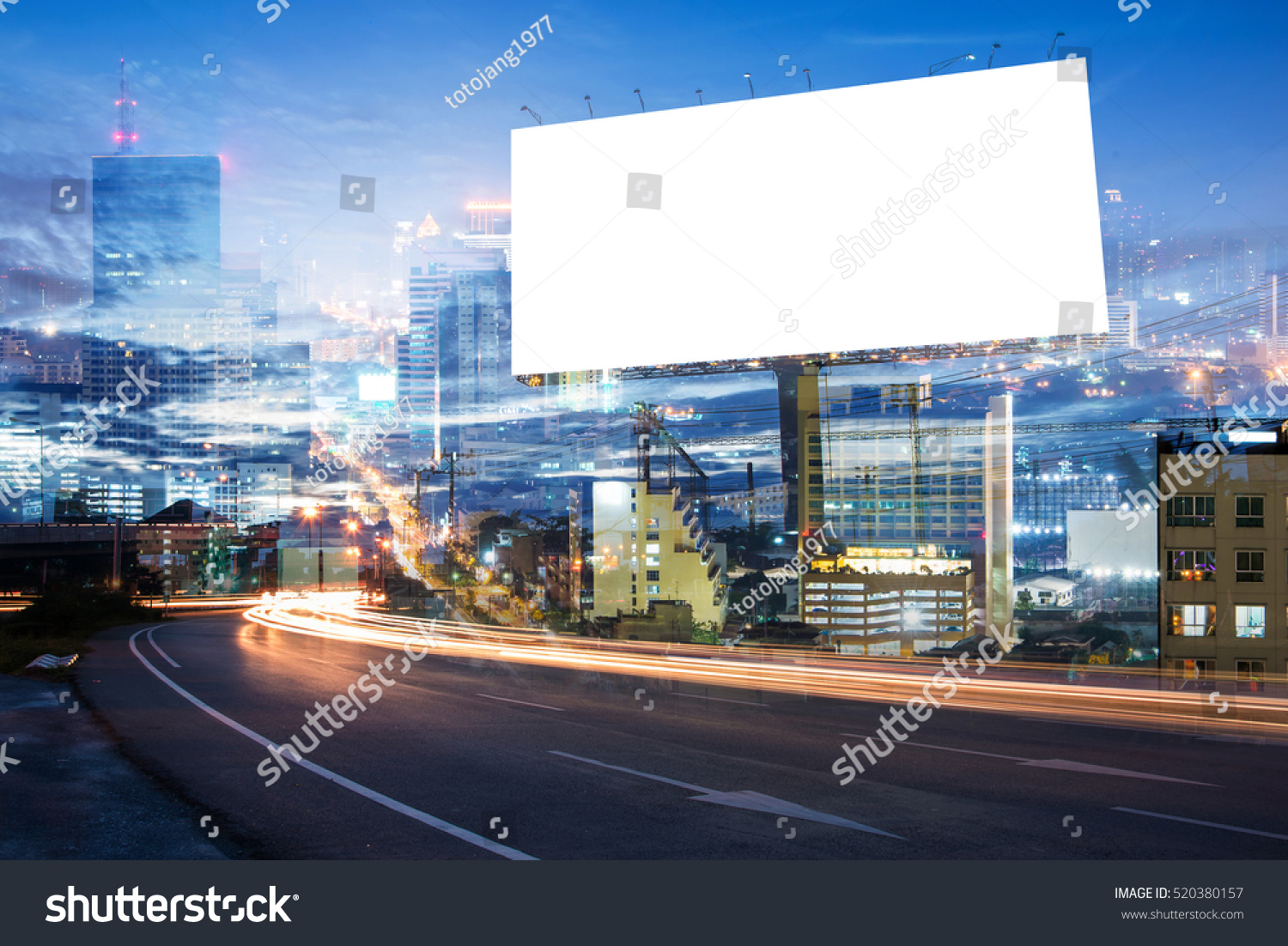 double exposure of blank billboard for advertisement at twilight time with light trails on the road at dusk  #520380157