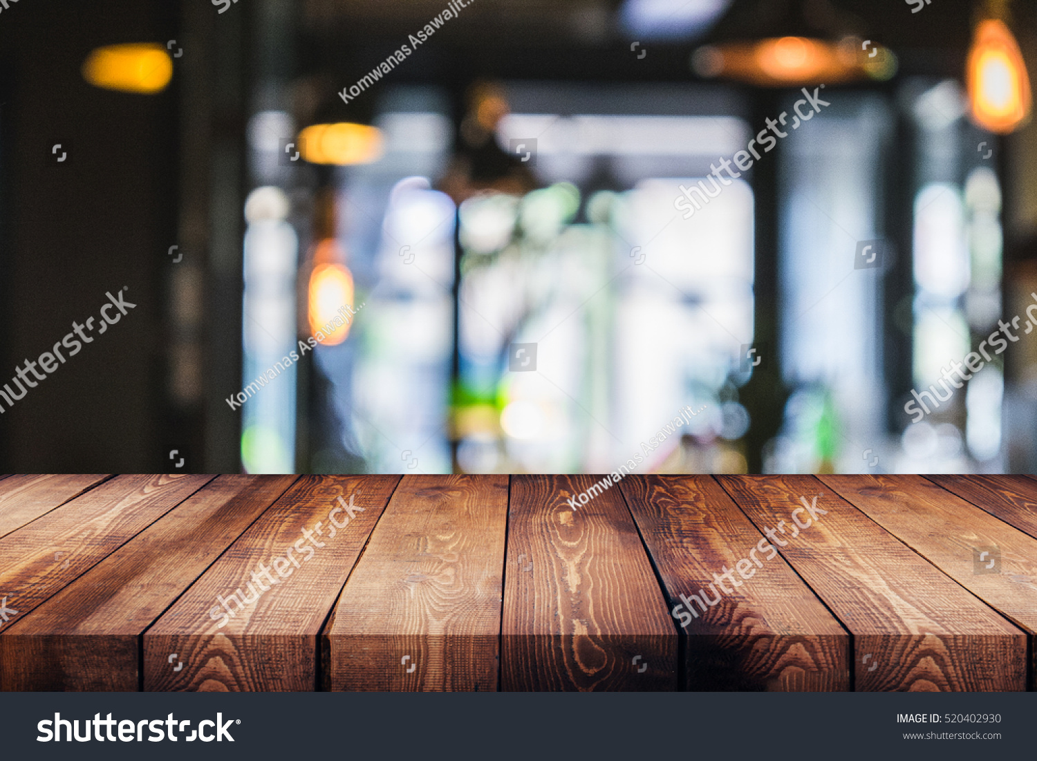 wood table on blur of cafe, coffee shop, bar, background - can used for display or montage your products #520402930