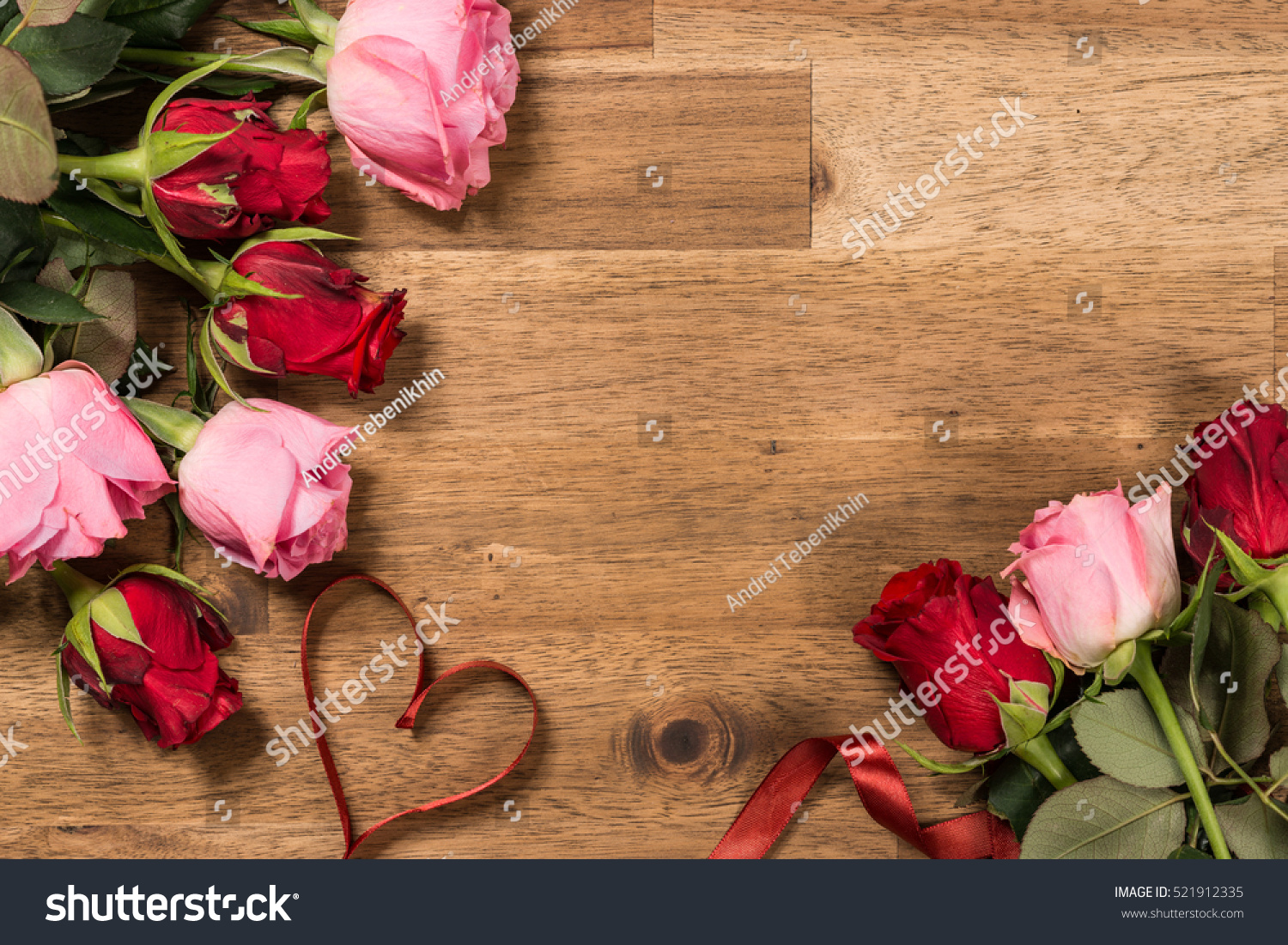 Roses  and red ribbon on wooden background. Valentines day background #521912335