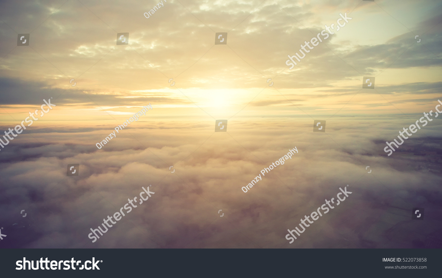 Sunny sky abstract background, beautiful cloudscape, on the heaven, view over white fluffy clouds, freedom concept.soft focus.Vintage color #522073858