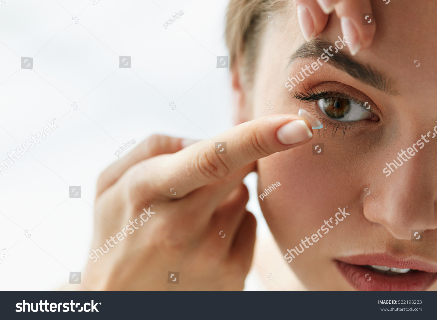 Contact Lens For Vision. Closeup Of Female Face With Applying Contact Lens On Her Brown Eyes. Beautiful Woman Putting Eye Lenses With Hands. Opthalmology Medicine And Health. High Resolution  #522198223