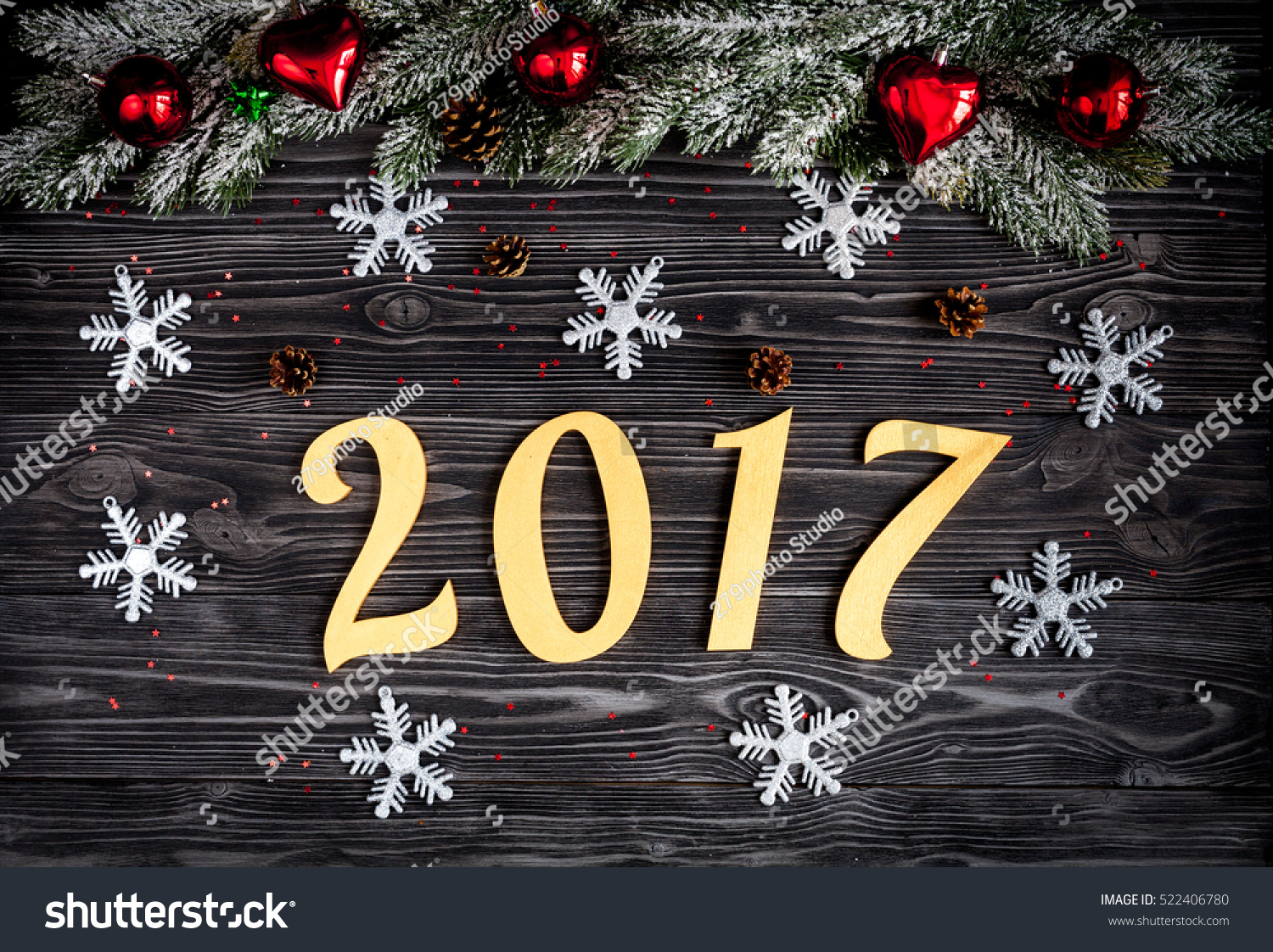 Christmas decorations, spruce branches on dark wooden background top view #522406780