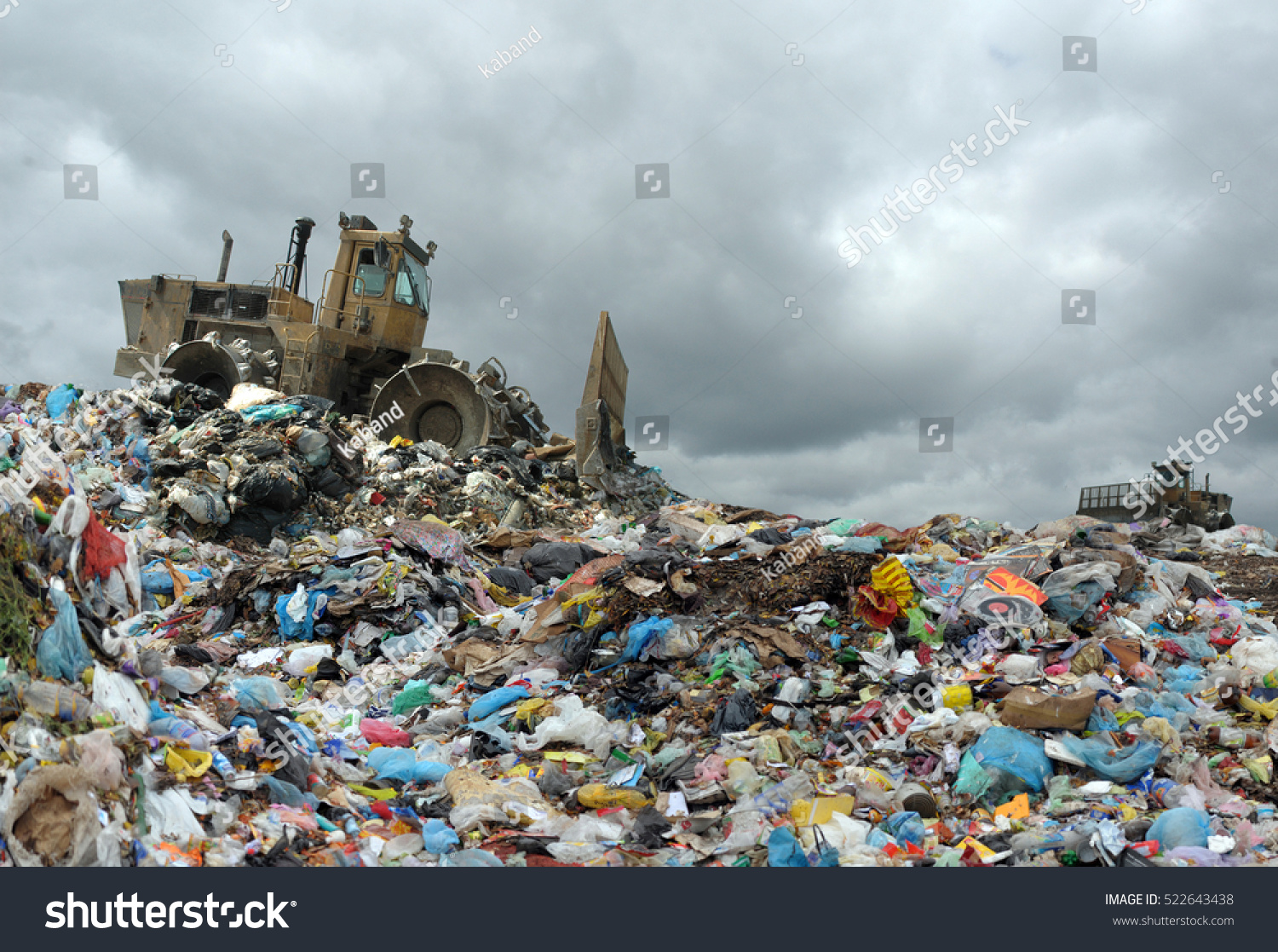 Garbage truck unloading at the dump #522643438
