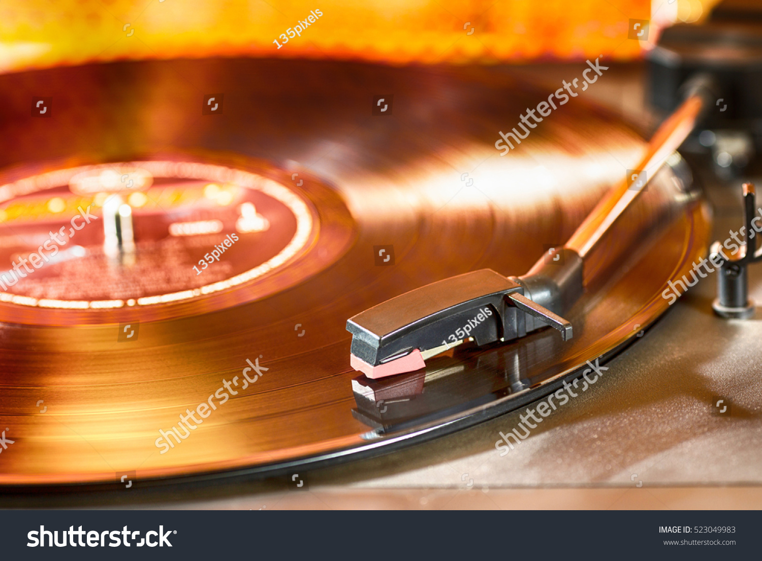 Vintage turntable with a record playing #523049983