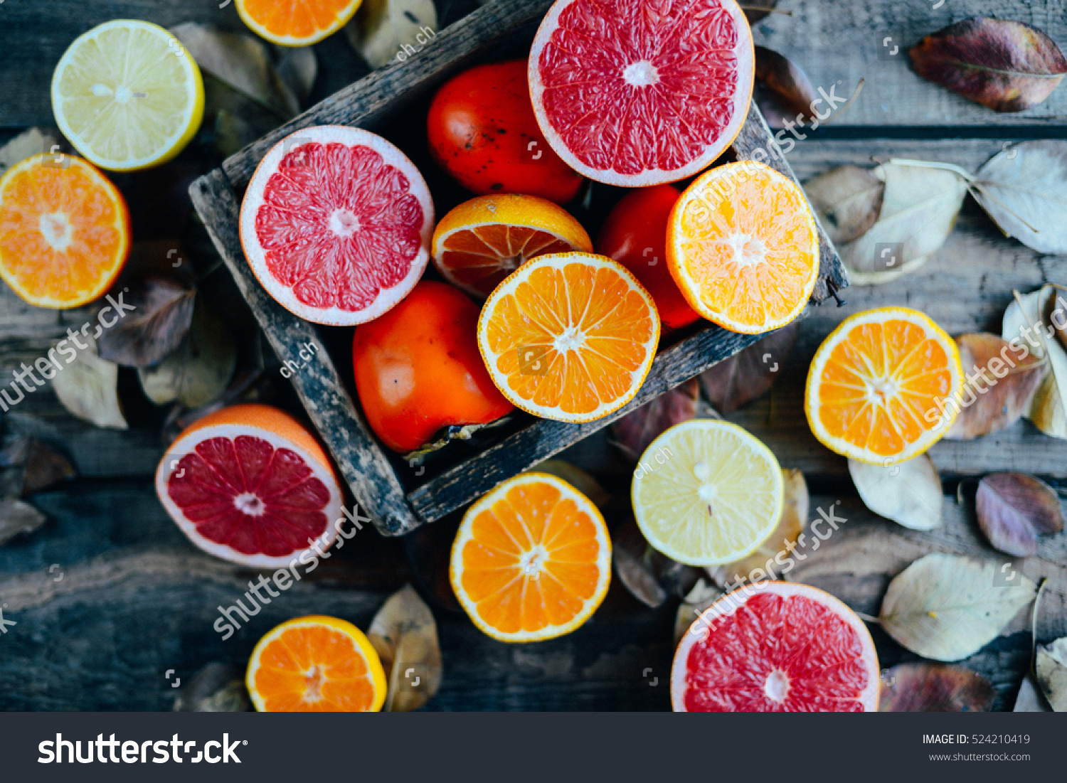 Fresh fruits. Mixed fruits background. Healthy eating, dieting. Background of healthy fresh fruits. Fruit salad - diet, healthy breakfast. pomegranate, persimmon, tangerine, banana, lemon #524210419
