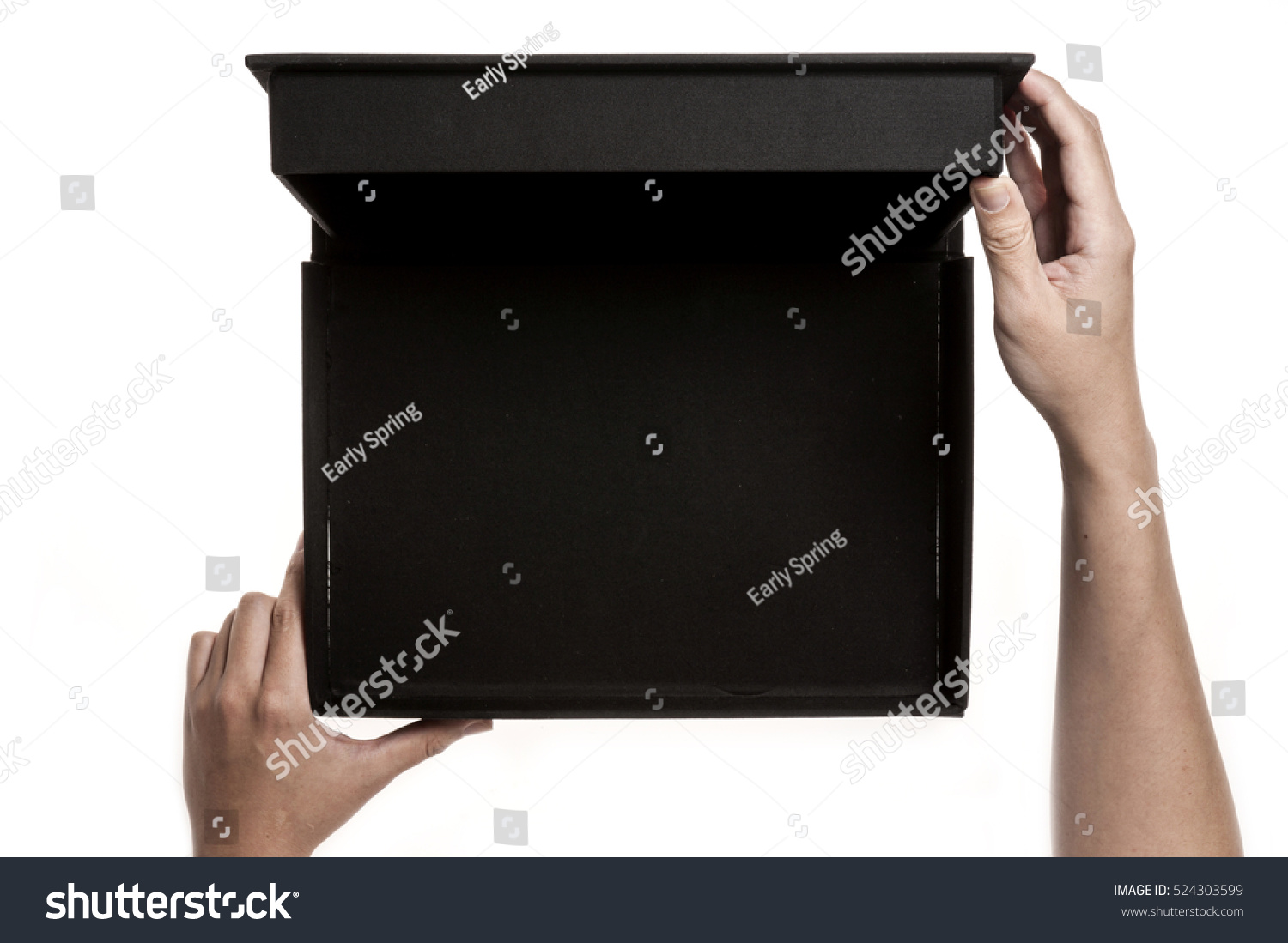 A man(male) hand hold a empty(blank, vacant) black box isolated white. #524303599