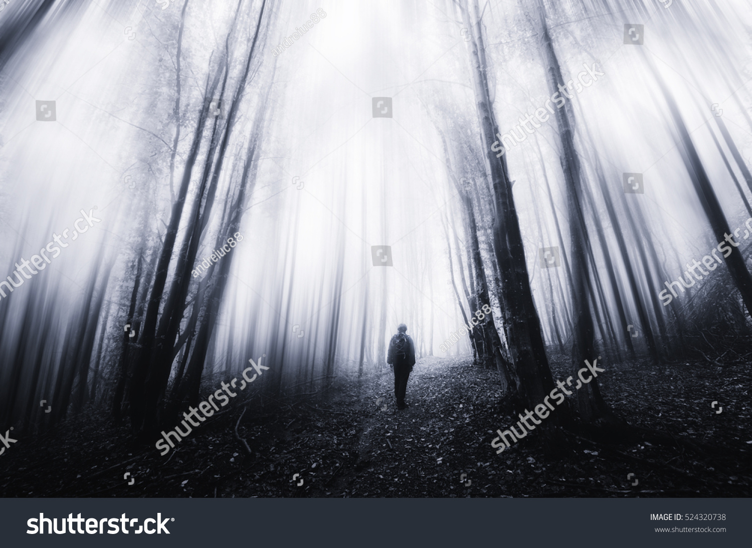 man walking in a surreal forest #524320738