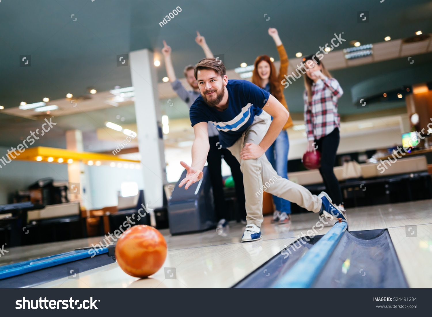 Friends enjoying recreational  bowling at club #524491234