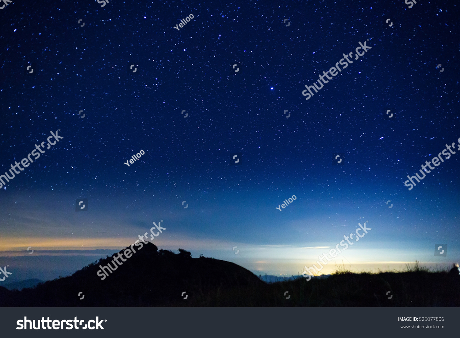 night sky with star on top of mountain #525077806