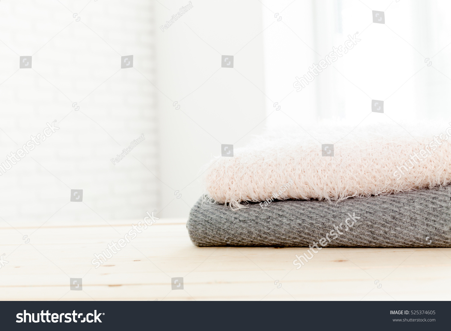 Stack of white cozy knitted sweaters  #525374605