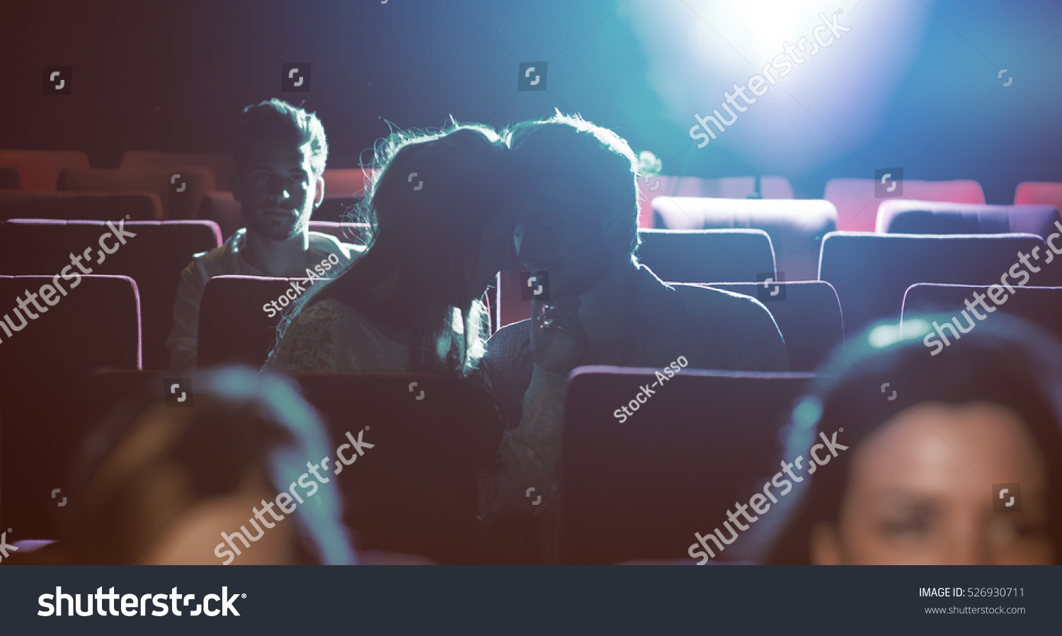 Young romantic loving couple kissing at the cinema, relationships and lifestyle concept #526930711