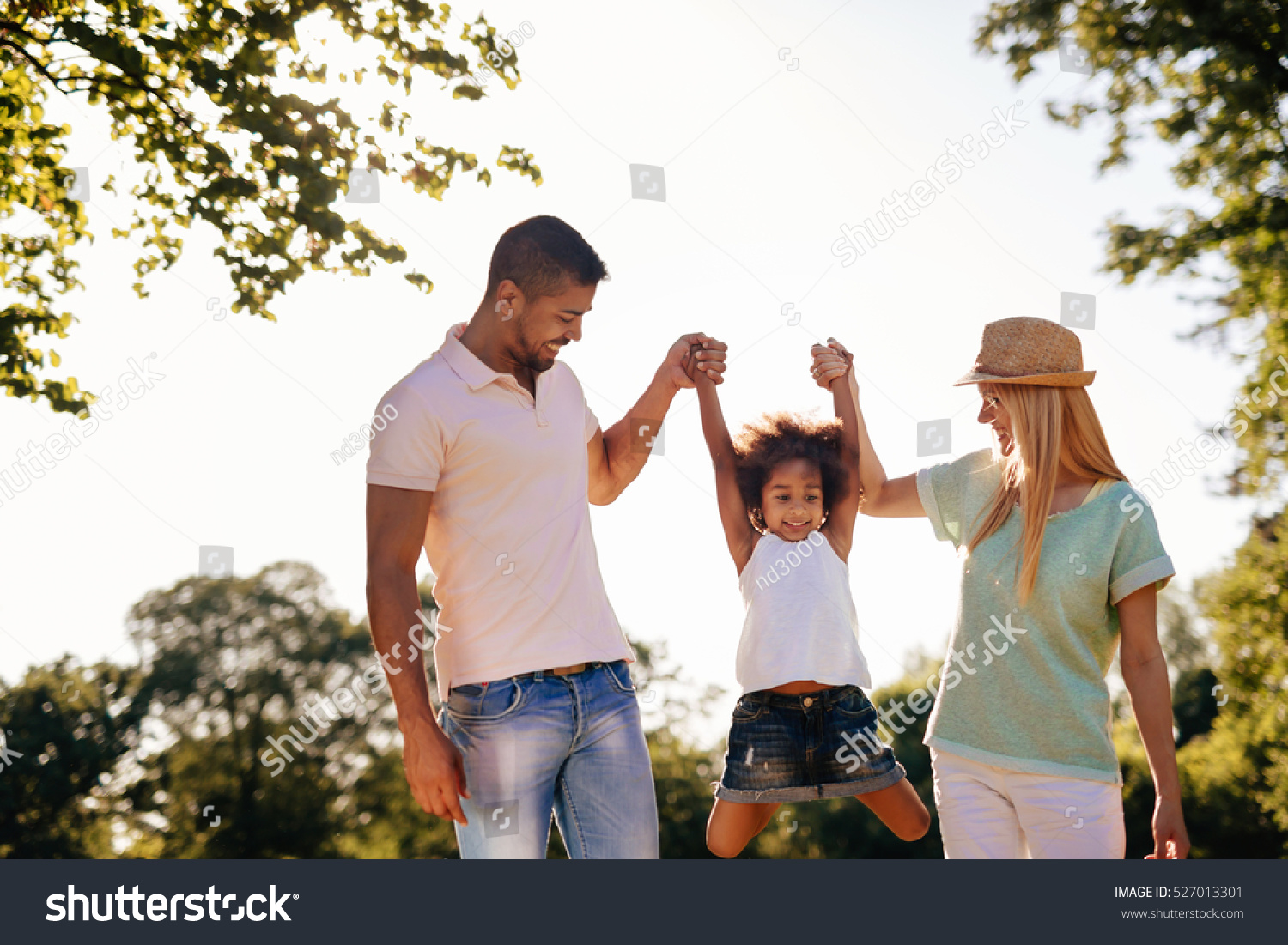 Playful family having fun outdoors and walking #527013301