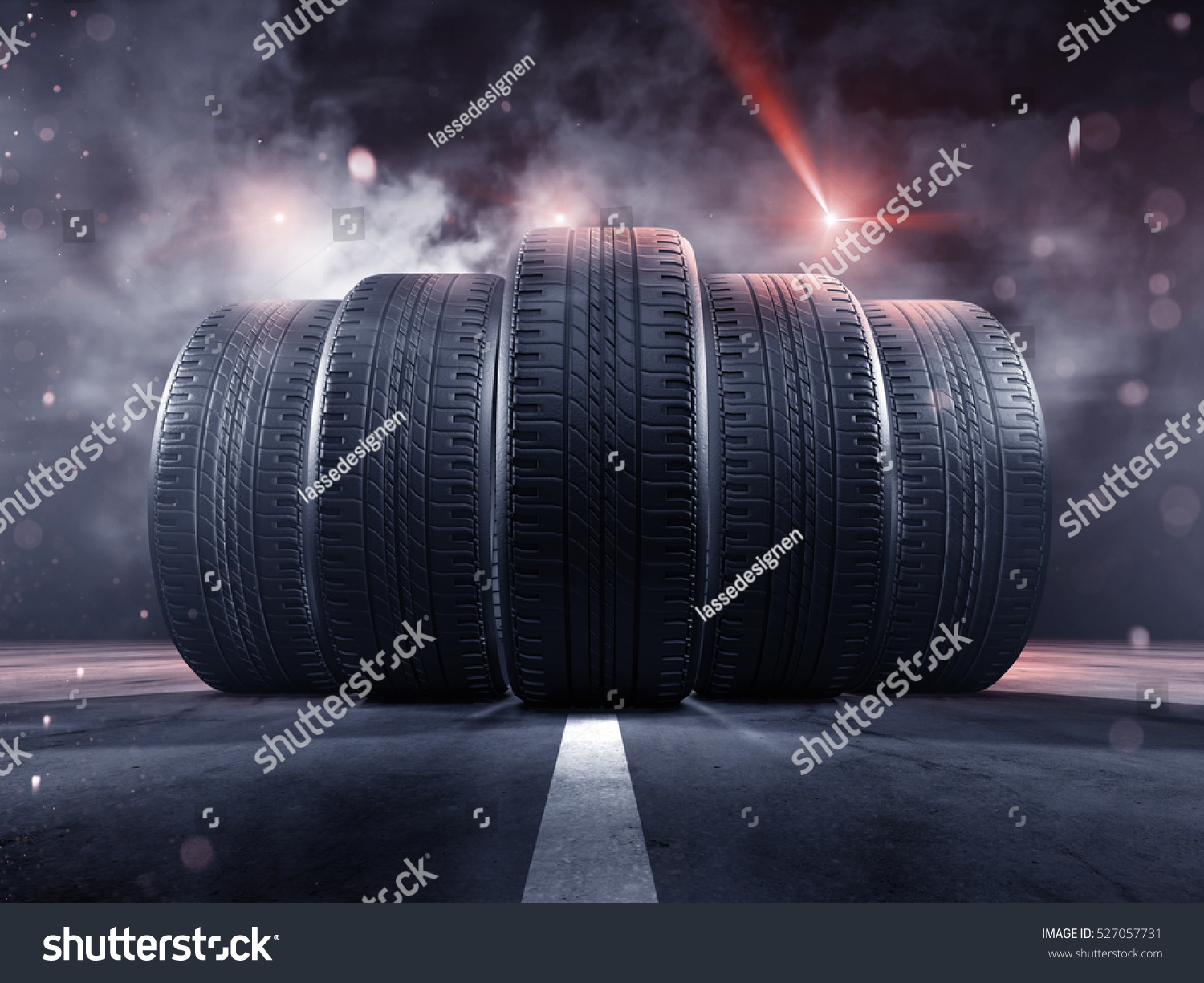 Five tires rolling on a street #527057731