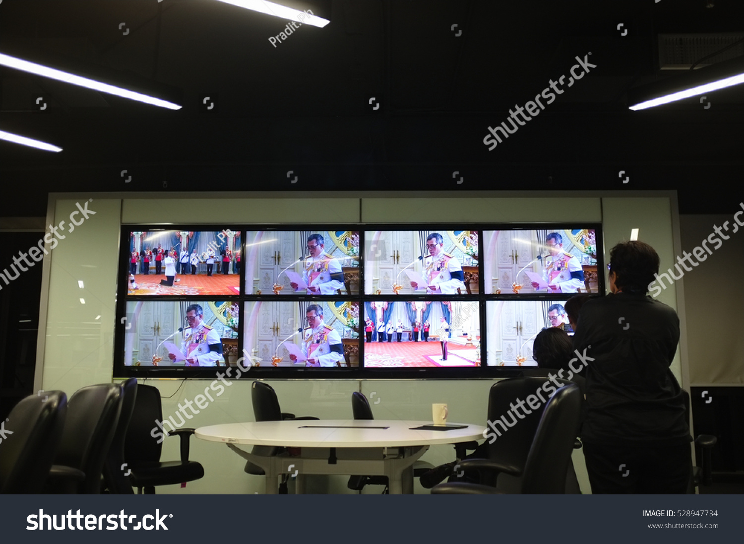 BANGKOK, THAILAND, Dec 1, 2016 - Reporters in The Nation editorial watching HM King Maha Vajiralongkorn ascended the throne as King Rama X on live TV on Thursday night. #528947734