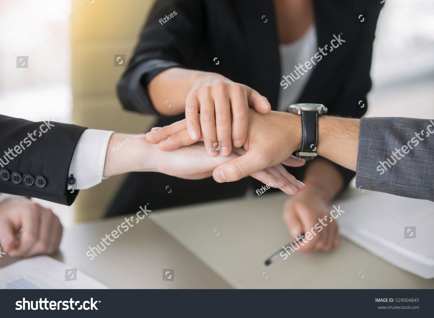 Close up of giving a high five, guarantee between potential partners, decide on marketing strategy for mutual business, profitable family business idea, running a business together. Teamwork concept #529004845