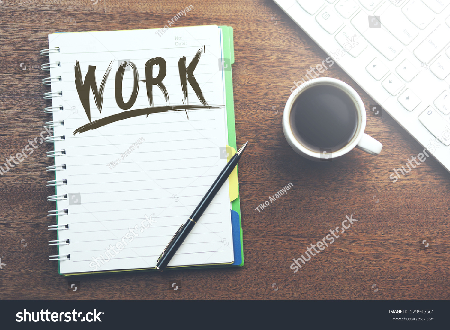 Work text on notebook with coffee and keyboard #529945561