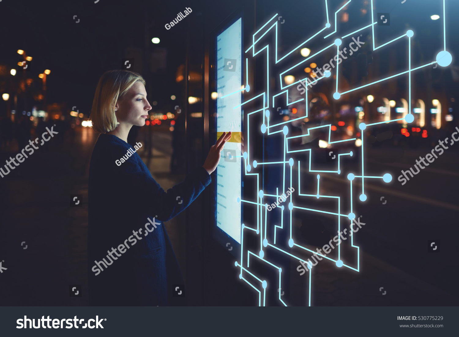 Young woman touching sensitive screen while selecting surface option. Female standing at big display with advanced innovative device with infographics design elements.Person with futuristic technology #530775229