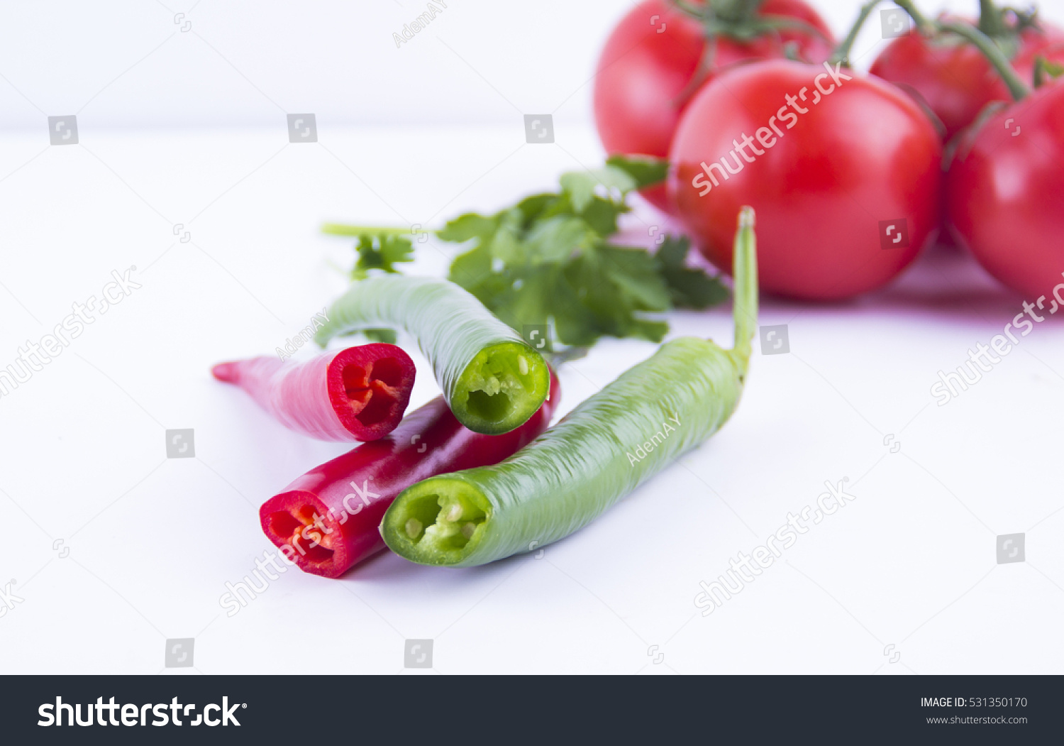 Fresh green and red chili pepper, tomato isolated on a white background
 #531350170