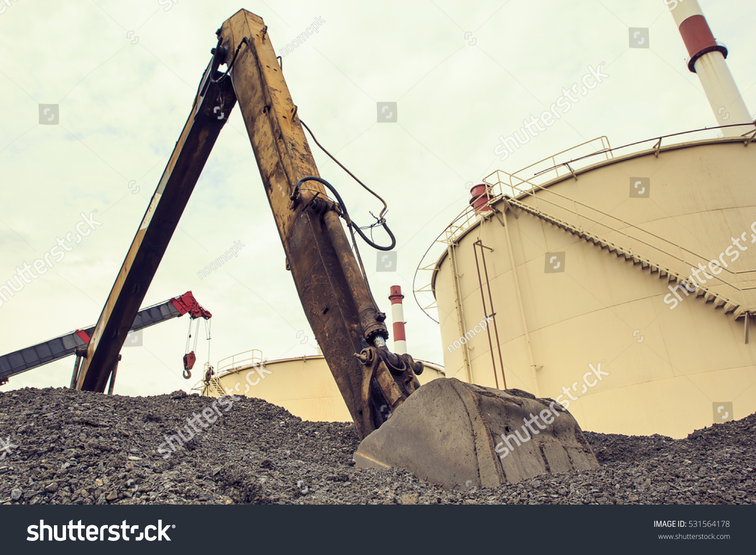 excavator yellow against construction site #531564178