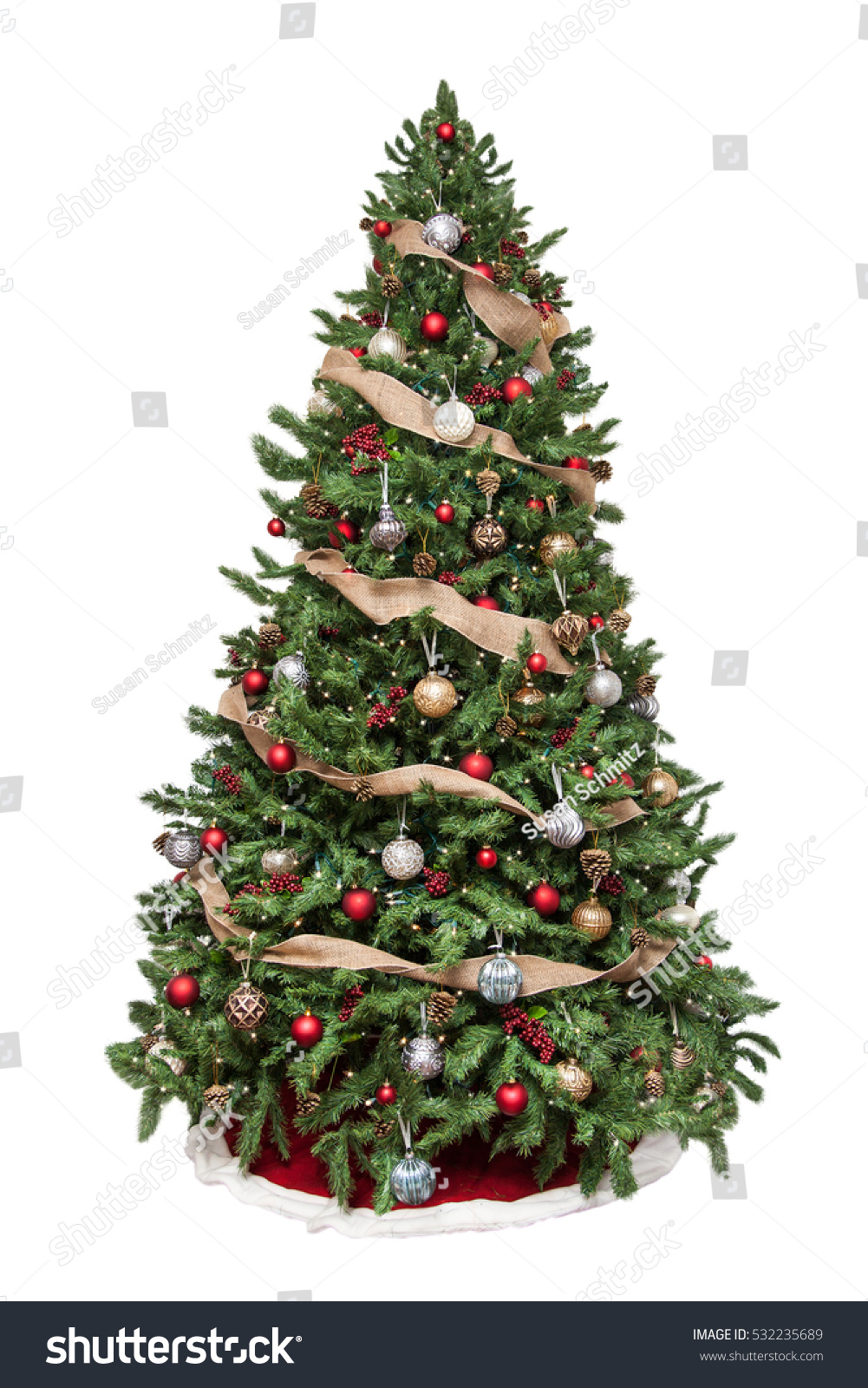 Isolated Christmas tree decorated with ornaments and burlap garland #532235689