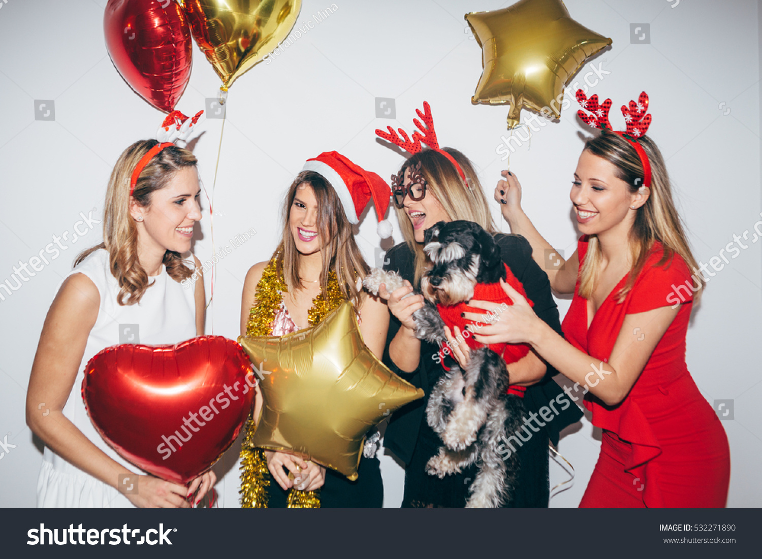 Four young woman celebrating and having fun. New year's party #532271890