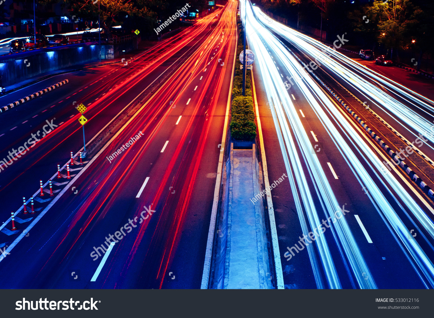 Long exposure photo of traffic with blurred traces from cars, top view. #533012116