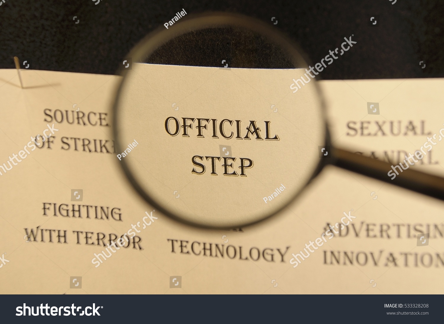 Text - headline of newspaper article - at loupe. Words "Official step" #533328208