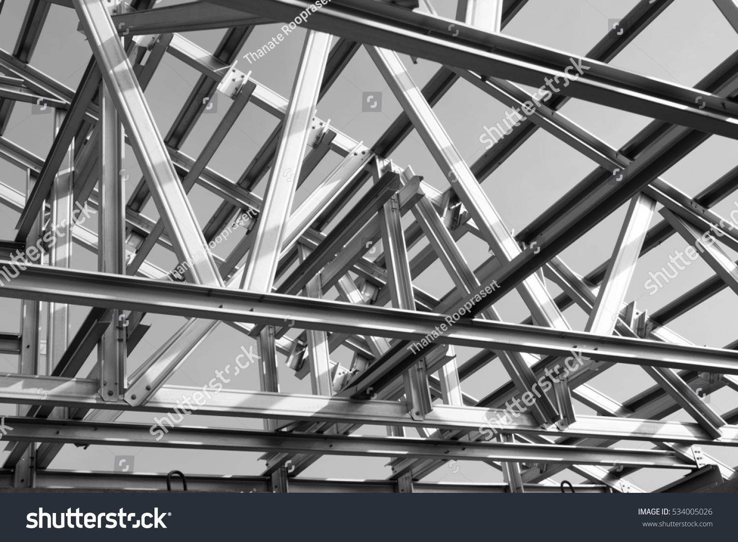 Black and white photo,Structure of steel roof frame for building construction. #534005026