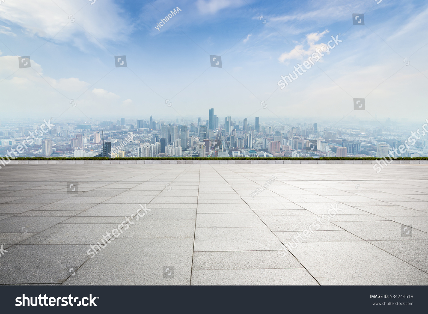 Panoramic skyline and buildings with empty concrete square floor #534244618