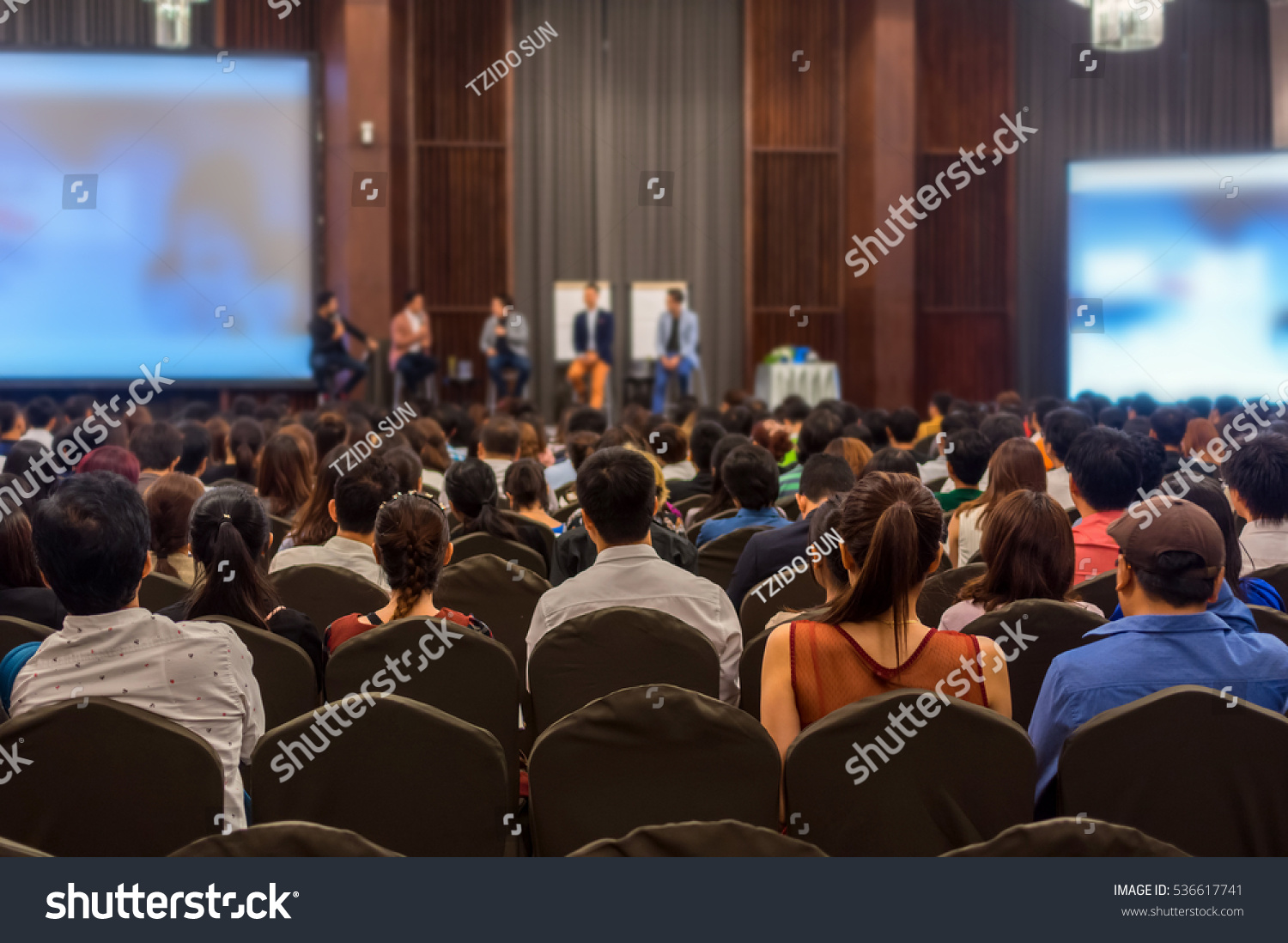Abstract blurred photo of conference hall or seminar room with attendee background #536617741