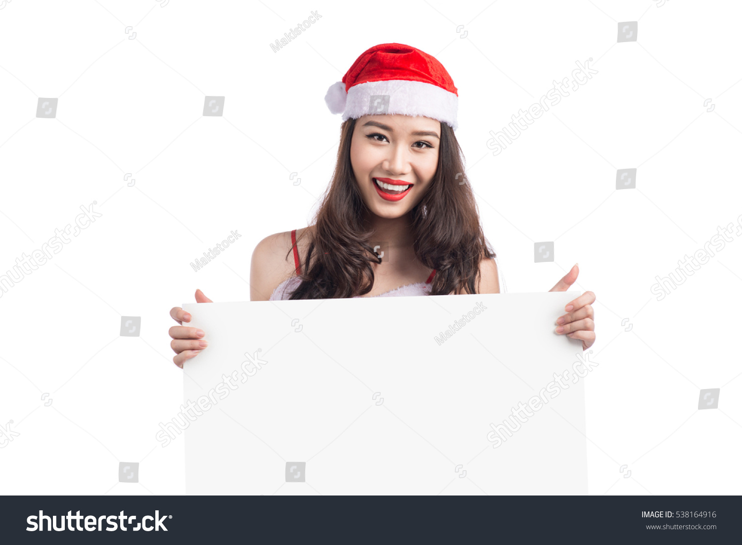 Asian Christmas girl with Santa Claus clothes holding blank sign isolated on white background #538164916