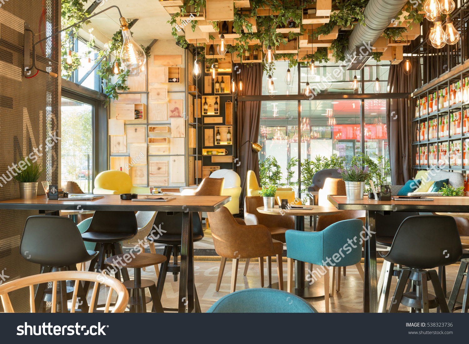 Interior of a modern urban restaurant in the morning sunlight #538323736